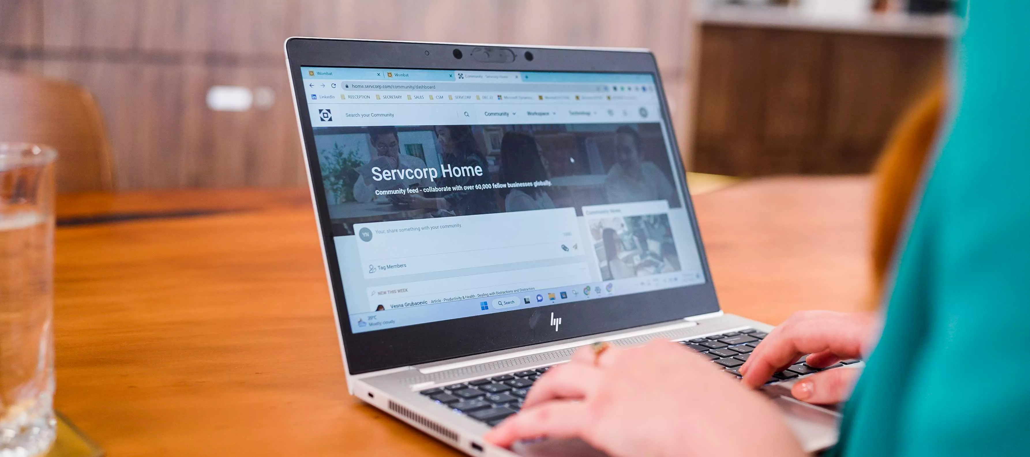 Extreme close up on a client using a laptop seeking assistance online from our committed IT team at Servcorp Bell Gully Building, Wellington