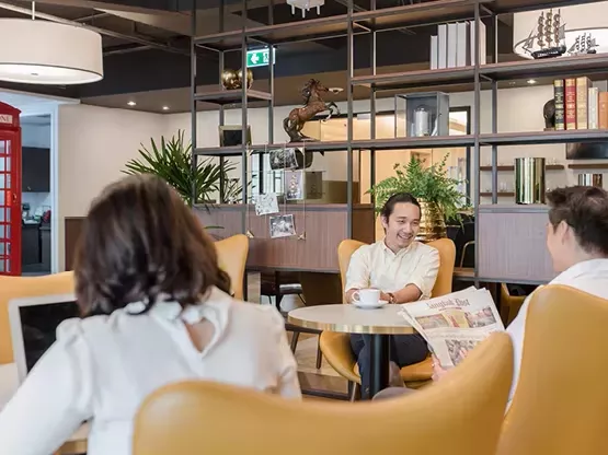 Collaborative breakout spaces with clients enjoying the modern co-working spaces in Servcorp Avaya House, Macquarie Park